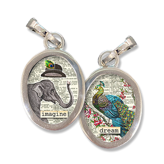 This two sided, charm has the word Imagine on the front with an elephant in a top hat illustration